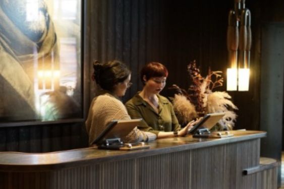 Front Desk Team Huddling At The Hotel