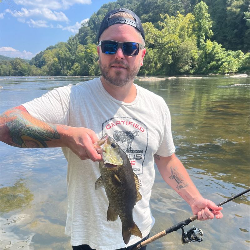 Travis Kirkley Holding A Fish